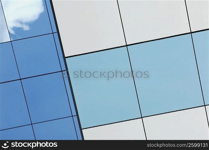Reflection of sky and clouds on a building