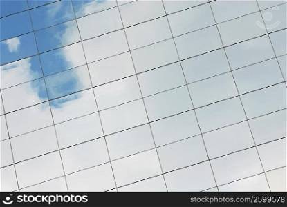 Reflection of sky and clouds on a building