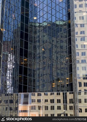 Reflection of skyscrapers on the glass of another building, Golden Square Mile, Montreal, Quebec, Canada