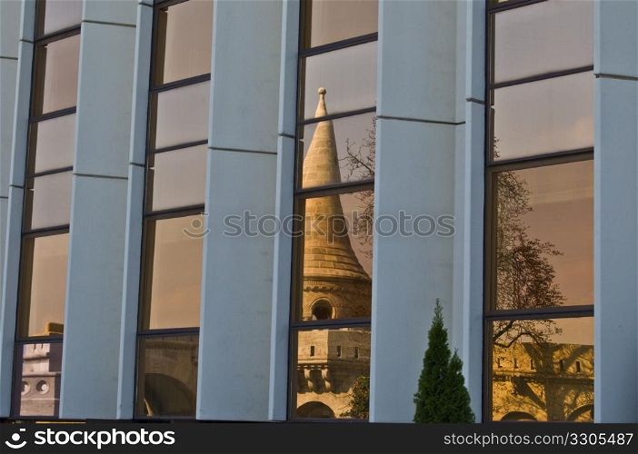 reflection of the fisherman&rsquo;s bastion in toned windows
