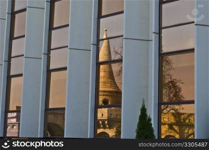 reflection of the fisherman&rsquo;s bastion in toned windows
