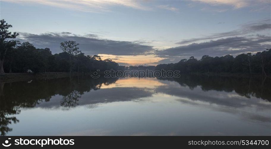 Reflection of trees and clouds on water, Tonle Sap, Cambodia