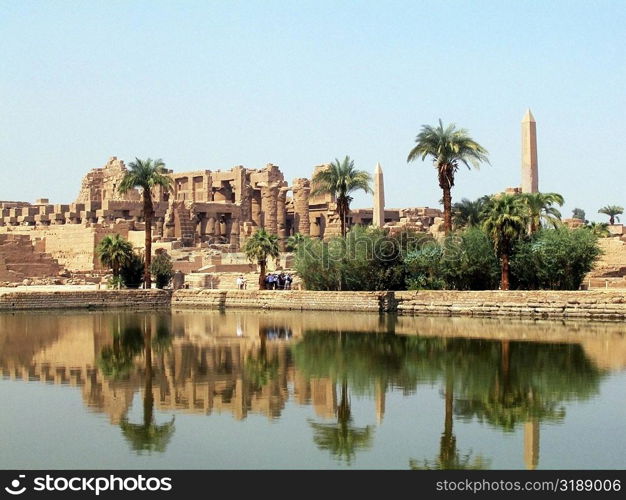 Reflection of trees and temple in water, Temples Of Karnak, Luxor, Egypt