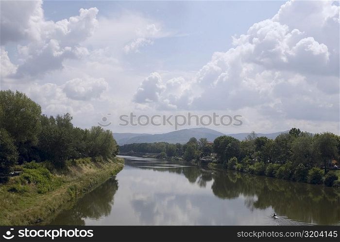 Reflection of trees in water, Arno River, Florence, Italy