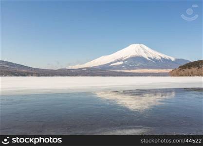 Reflection of Winter Mount Fuji at Iced Yamanaka Lake in snow winter season Japan