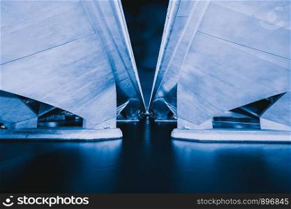 Reflection under Esplanade Bridge in structure of architecture concept, urban city, Singapore Downtown area at night.