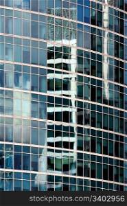 Reflections in a glass skyscraper wall, abstract background