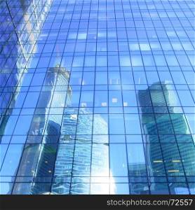 Reflections of modern office buildings - architectural and business background
