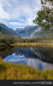 Reflections of the Southern Alps in Peter&rsquo;s Pool New Zealand