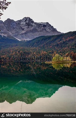 Reflections of the sunrise at the Eibsee