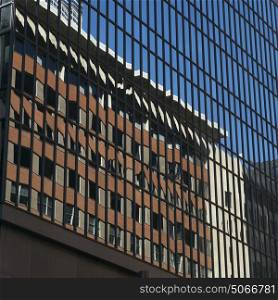 Reflections on modern glass building, Minneapolis, Hennepin County, Minnesota, USA