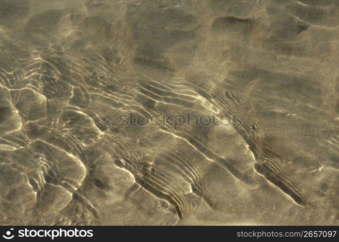 Reflexions on water surfase, beach sand bottom