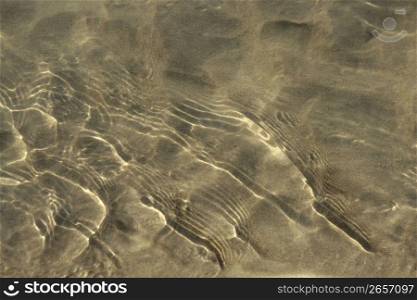 Reflexions on water surfase, beach sand bottom