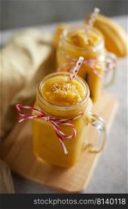 Refreshing and healthy mango smoothie in glasses. 