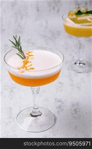 Refreshing cocktail decorated with sprig of rosemary