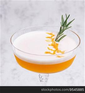 Refreshing cocktail decorated with sprig of rosemary
