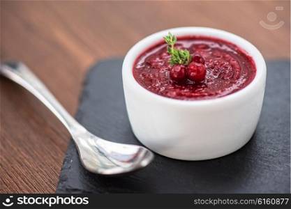 Refreshing cranberry sorbet . Refreshing cranberry sorbet at white bowl