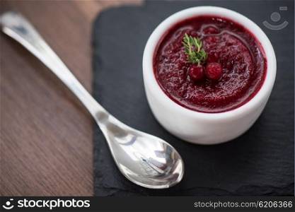 Refreshing cranberry sorbet. Refreshing cranberry sorbet at white bowl