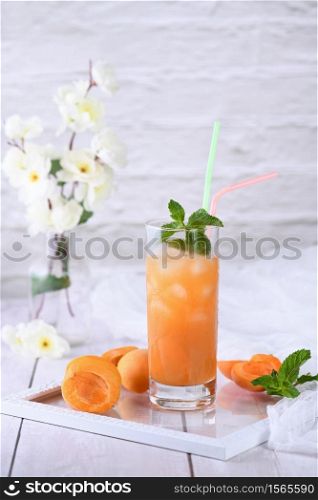 Refreshing, freshly cooked non-alcoholic cocktail made from apricot juice and mint