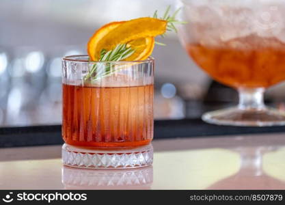 Refreshing fruity and alcoholic summer cocktail on dark background