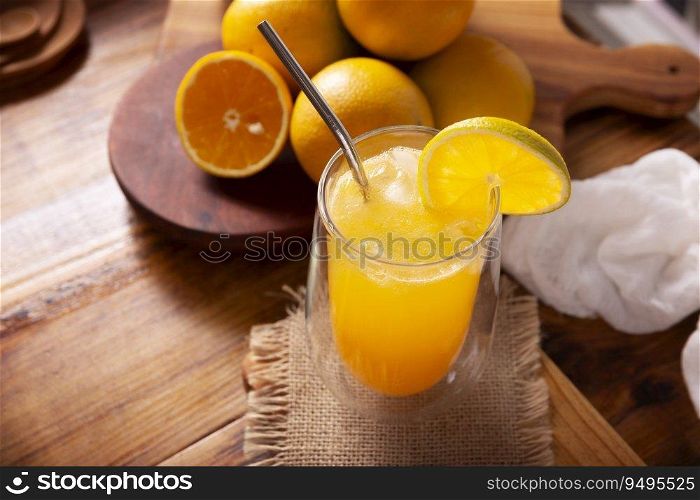 Refreshing homemade orangeade, a natural hydrating drink made from orange juice, very popular in several countries, ideal to drink in hot summers.