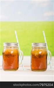 Refreshing iced tea to drink with a straw