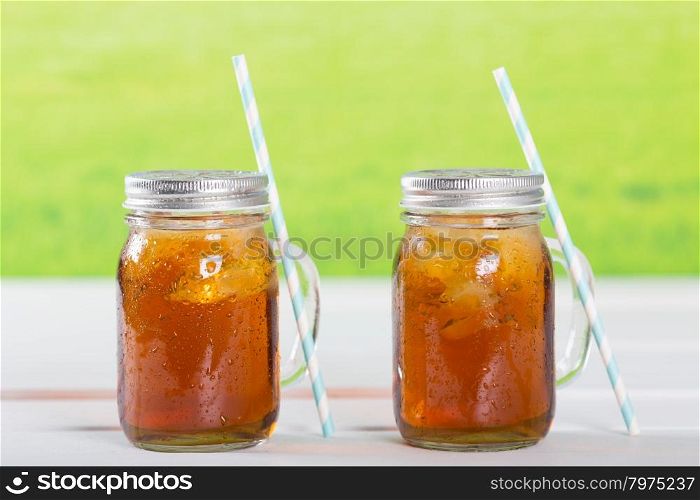 Refreshing iced tea to drink with a straw