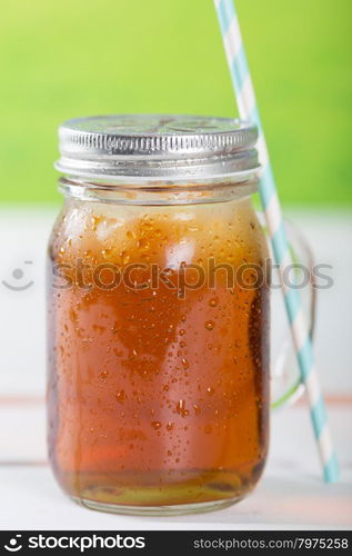 Refreshing iced tea to drink with a straw