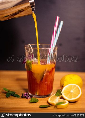 Refreshing summer tea with cherry flavor and mango juice