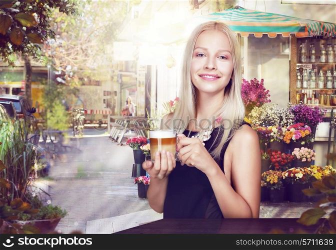 Refreshment. Happy Woman with Cup of Coffee in a Street Cafe