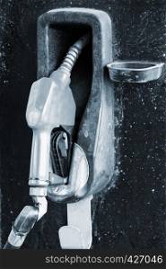 Refueling hose at modern petrol gas station