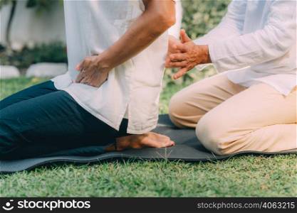 Reiki Course Instruction. Woman sitting , having a Reiki healing treatment. . Reiki Course Instruction