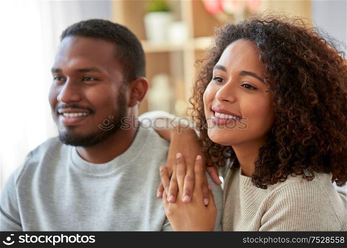 relations and people concept - happy african american couple at home. happy african american couple at home