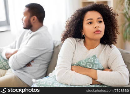 relationship difficulties, conflict and people concept - unhappy african american couple having argument at home. unhappy couple having argument at home