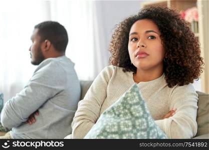 relationship difficulties, conflict and people concept - unhappy african american couple having argument at home. unhappy couple having argument at home