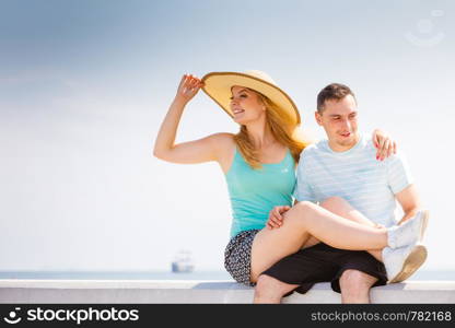 Relationship goals, outdoor relaxation, love and friendship concept. Man and woman sitting together outside hugging, having date.. Man and woman sitting together outside