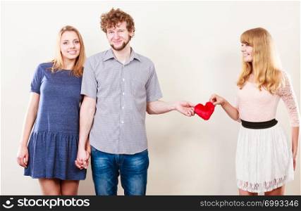 Relationships and feelings in triangle. Happy relationship of three people. Two women having one man. Forbidden love concept.. Happy triangle relationship