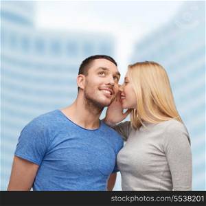 relationships, love and couple concept - smiling girlfriend telling boyfriend secret