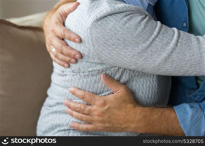 relationships, marriage and old people concept - close up of married senior couple hugging. close up of married senior couple hugging