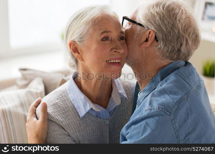 relationships, old age and people concept - happy senior couple hugging at home. happy senior couple hugging at home