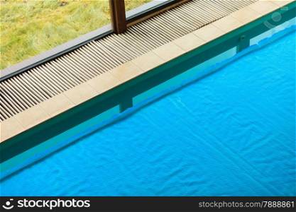 Relax active lifestyle or travel concept. Swimming pool at hotel close up, water covered with safety net grid