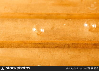 Relax and spa concept. Soap bubbles on wooden bench background in sauna room.