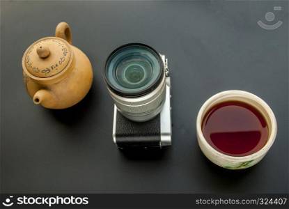 Relax, drink Chinese tea after taking a picture