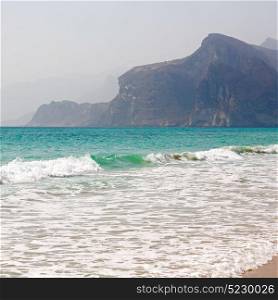 relax near sky in oman coastline sea ocean gulf rock and beach