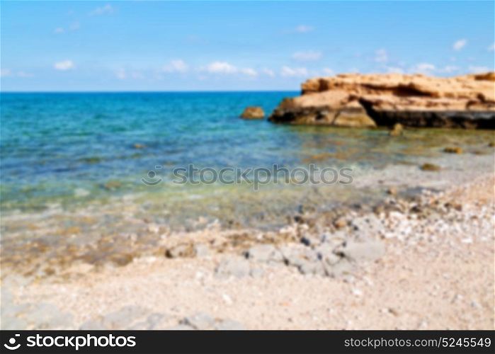 relax near sky in oman coastline sea ocean gulf rock and beach blurred