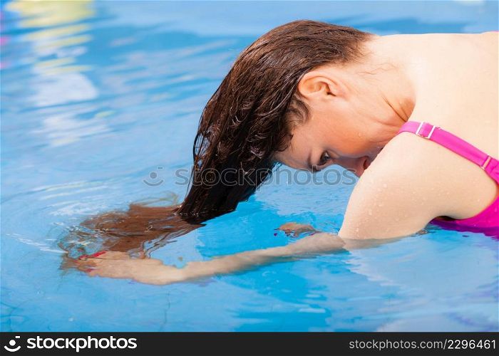 Relax, spa hotel, resort concept. Charming woman having fun in swimming pool, relaxing enjoying the water. woman enjoying the water in swimming pool