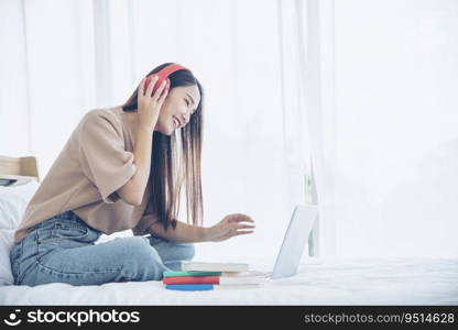 Relax woman holding book read on bed using headphone listen music. Young woman relaxation reading open book leisure mind. Happiness beautiful woman person