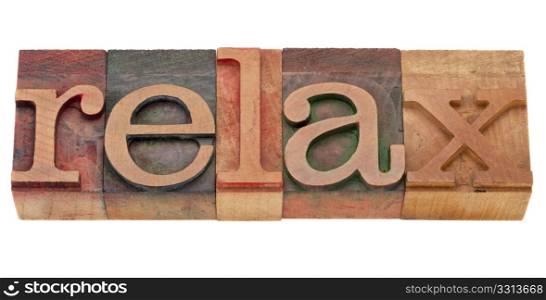 relax word in vintage wood letterpress printing blocks, isolated on white