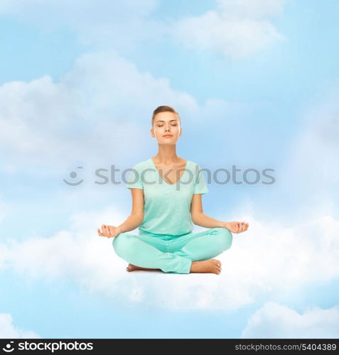 relaxation, meditation and lifestyle concept - girl on the cloud in lotus position and meditating