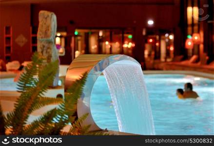 Relaxation pool in spa with waterfall